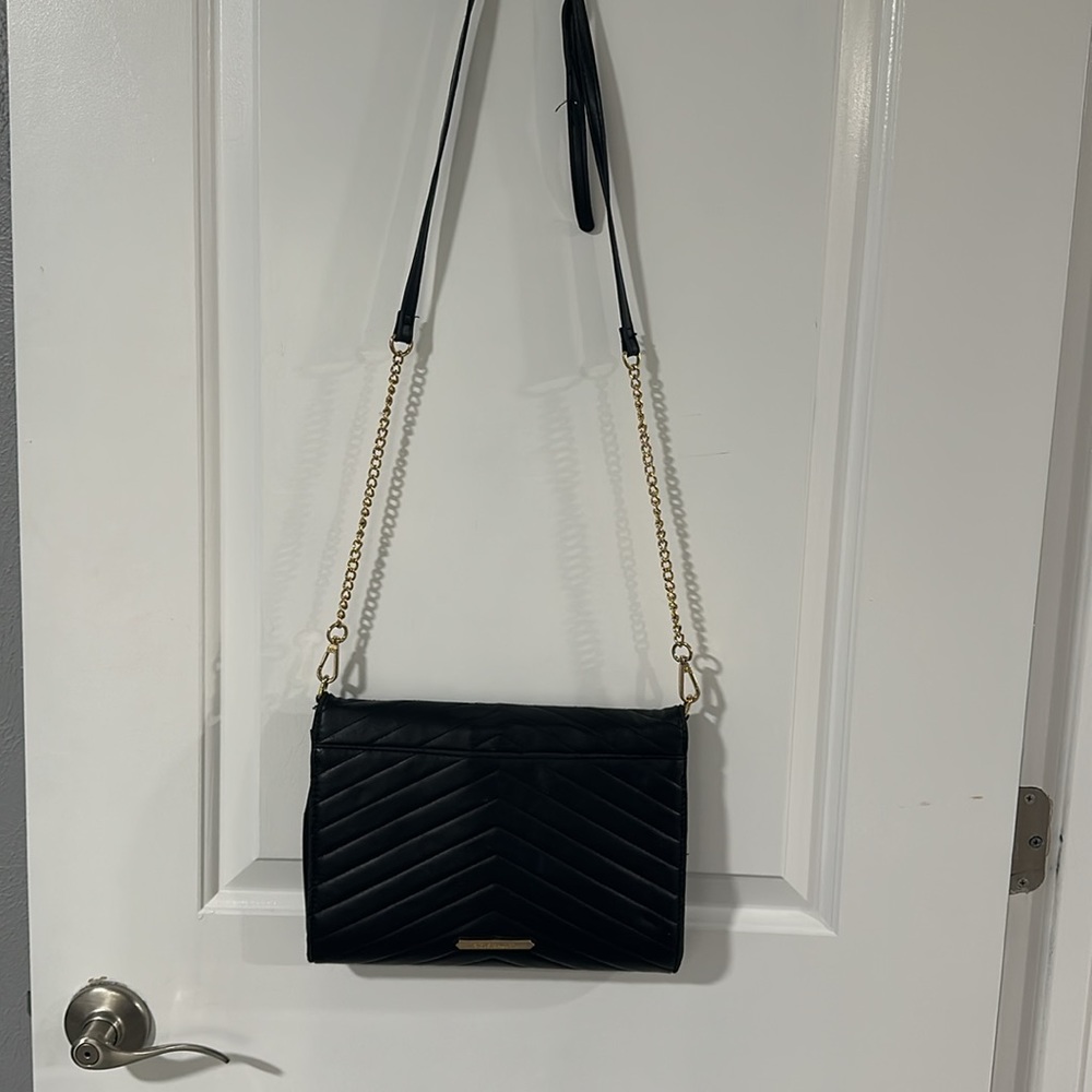 ⭐️SOLD⭐️
Steve Madden Black and Gold Crossbody - Picture 9 of 14